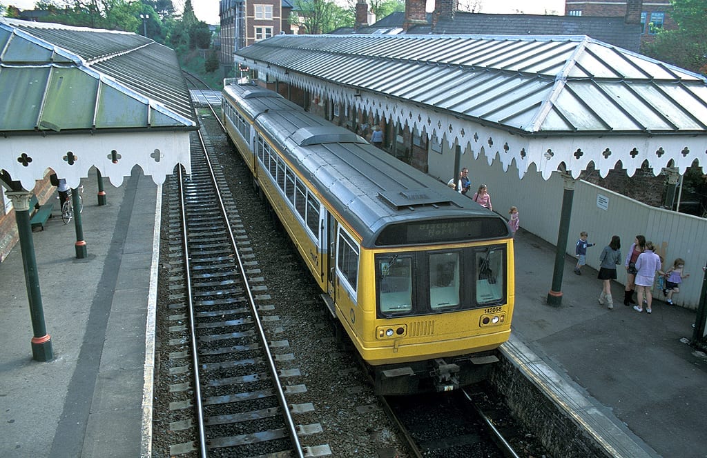 A Manchester and Blackpool bound Pacer 142 058 calls at Hale. May 2004.   <br />©2021 Bob Avery